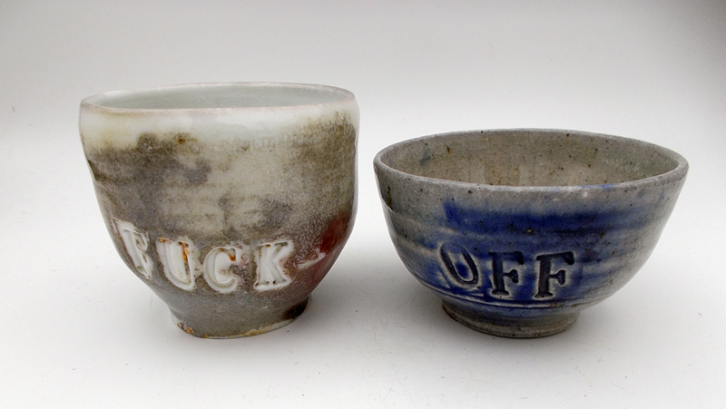 Danny Kostyshin pottery pieces, Gray bowls with words on each side