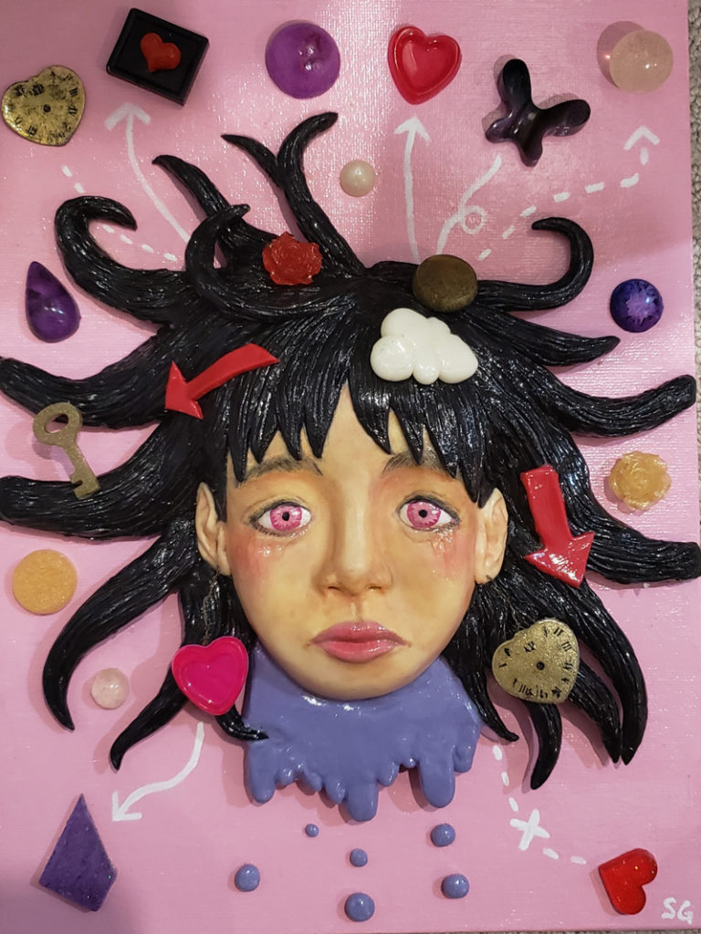 Serena Guan's piece titled "Chaos" (Air dry Clay & Resin), woman's face with black hair on a pink background